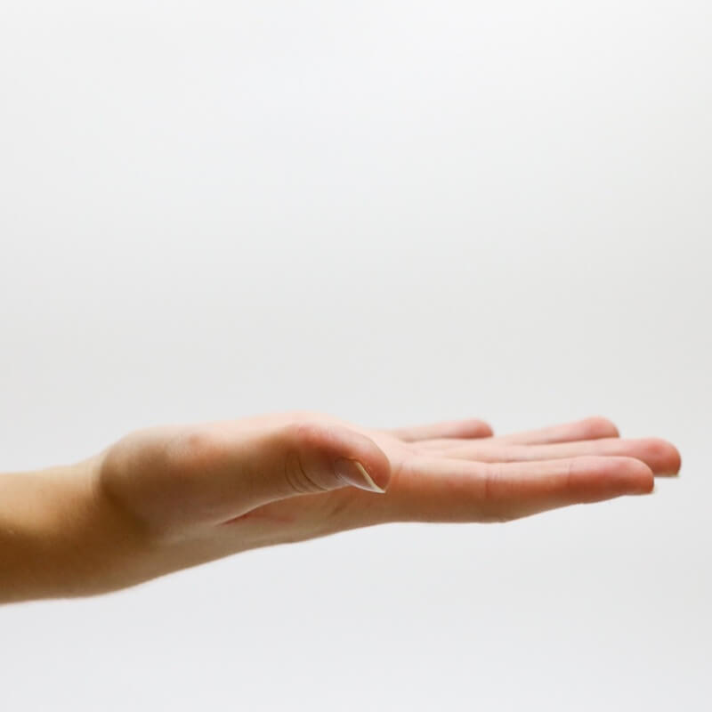 On a white background, a hand stands with the palm facing upwards.